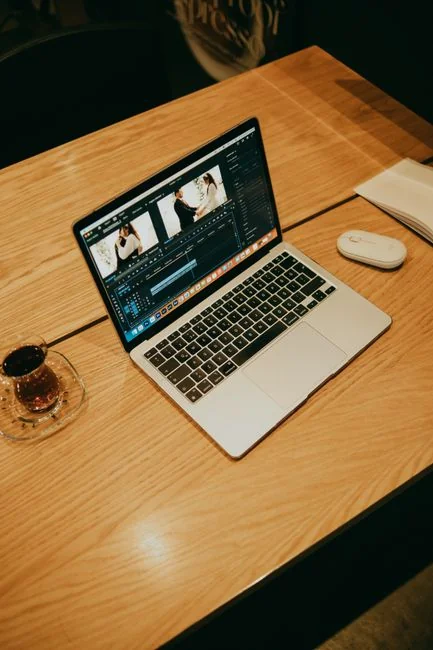 Wooden blocks arranged to spell SEO on a laptop keyboard suggest digital marketing ideas.